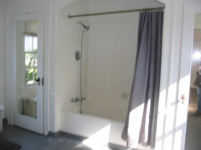 a bathroom with a tub and shower