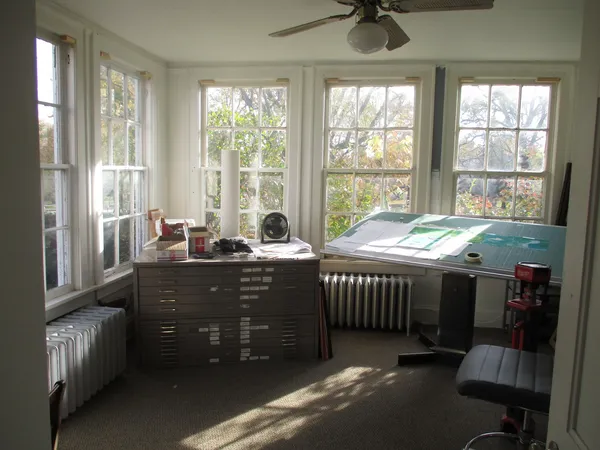 a bed room with a bed and a window
