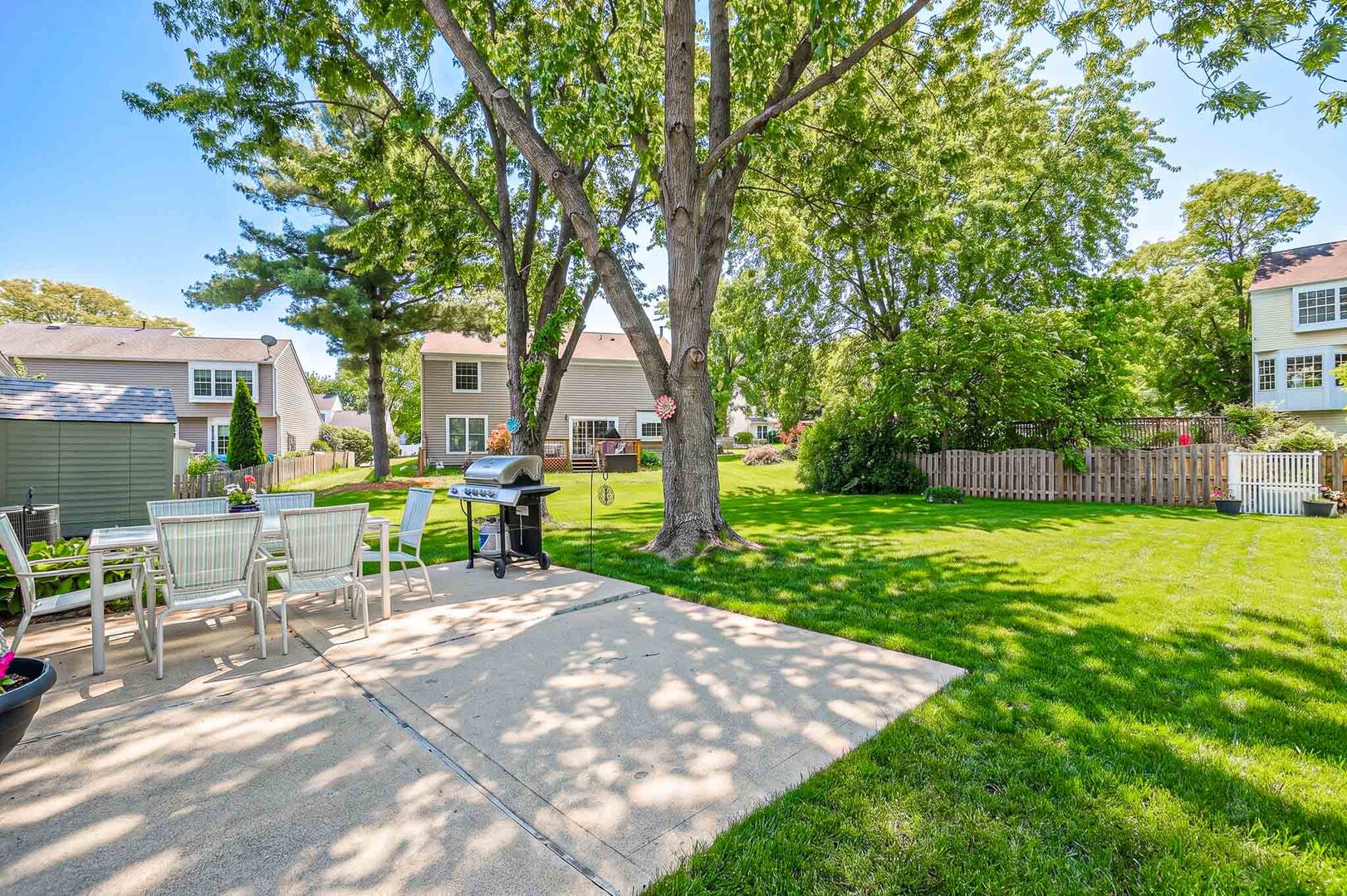 830 Hawk Lane Carol Stream, IL 60188 - Photo 29 of 30 a view of a chair and table in backyard of the house