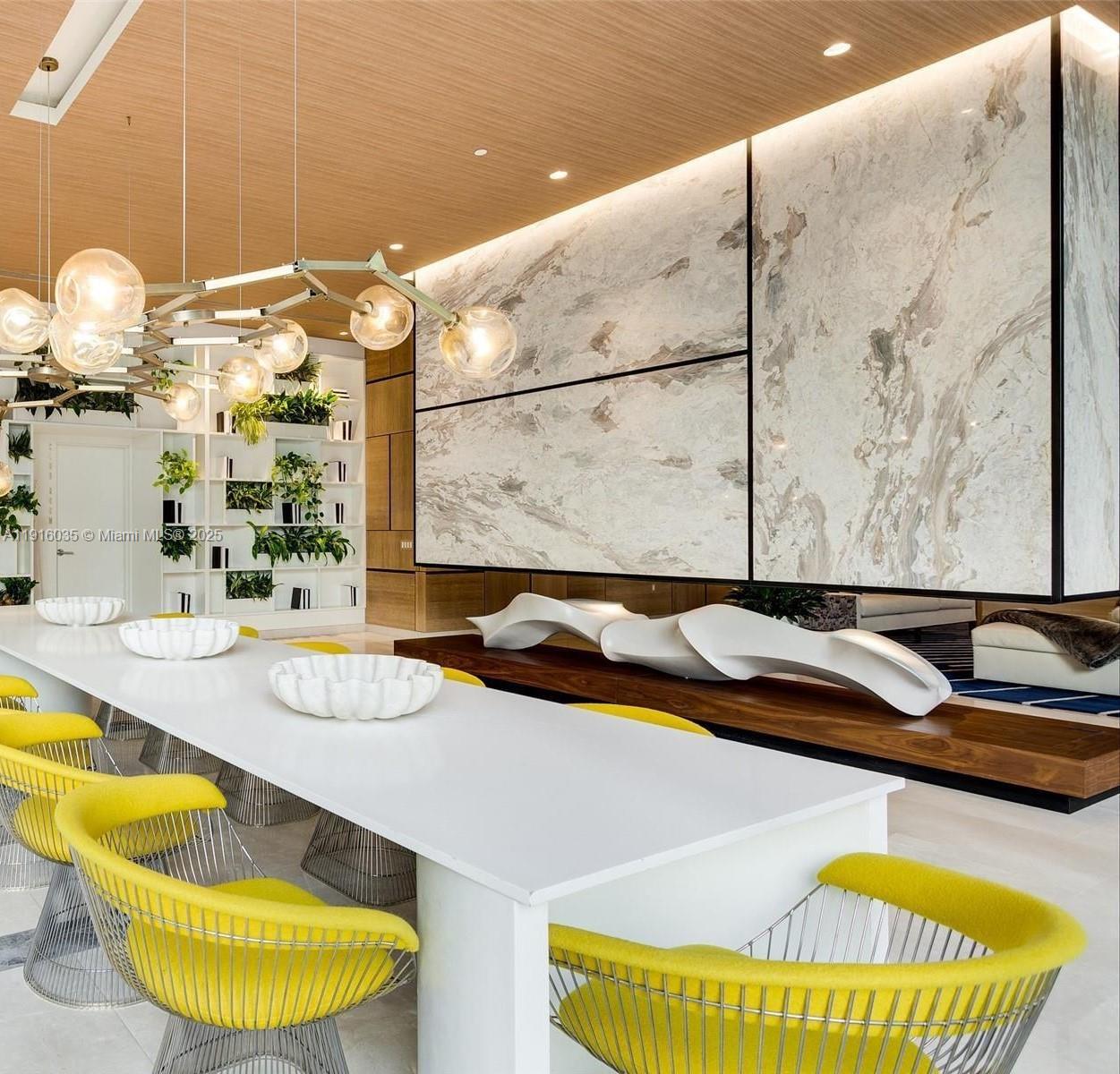 55 Southwest 9th Street, Unit 2902 Miami, FL 33130 - Photo 13 of 22 a bathroom with a granite countertop tub and a large mirror