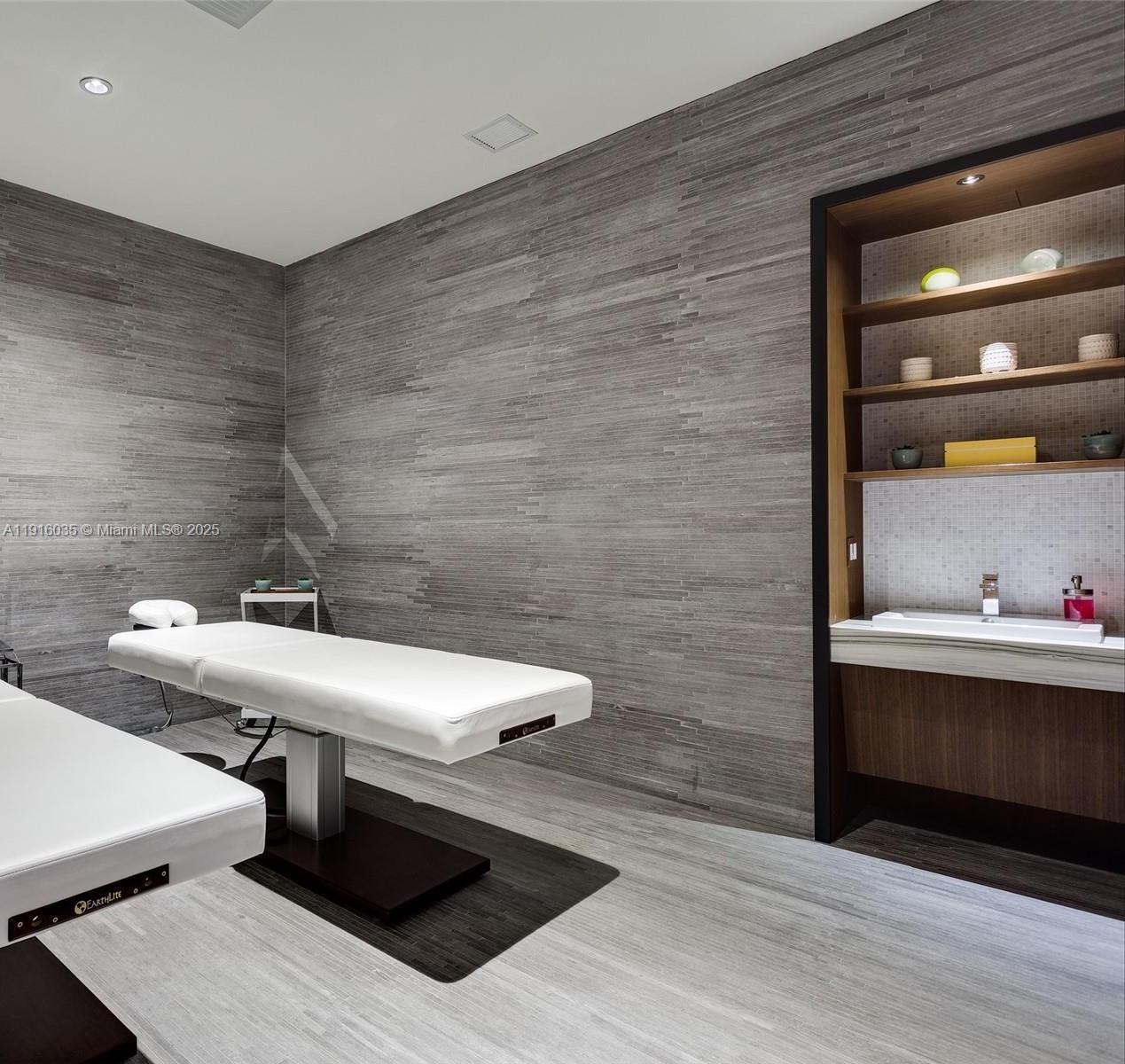 55 Southwest 9th Street, Unit 2902 Miami, FL 33130 - Photo 14 of 22 a bathroom with a sink and a mirror