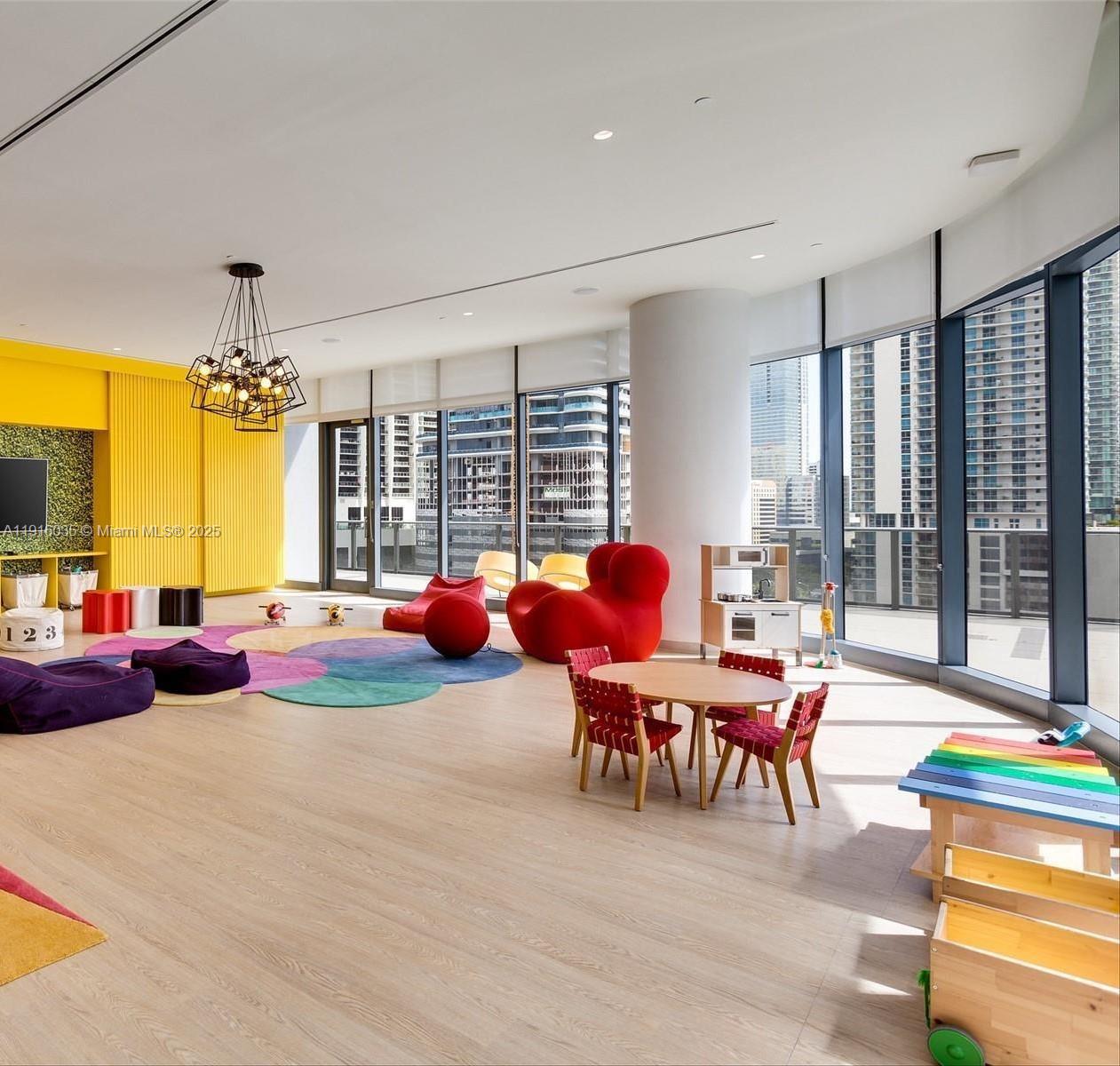 55 Southwest 9th Street, Unit 2902 Miami, FL 33130 - Photo 15 of 22 a bedroom with furniture and a large window