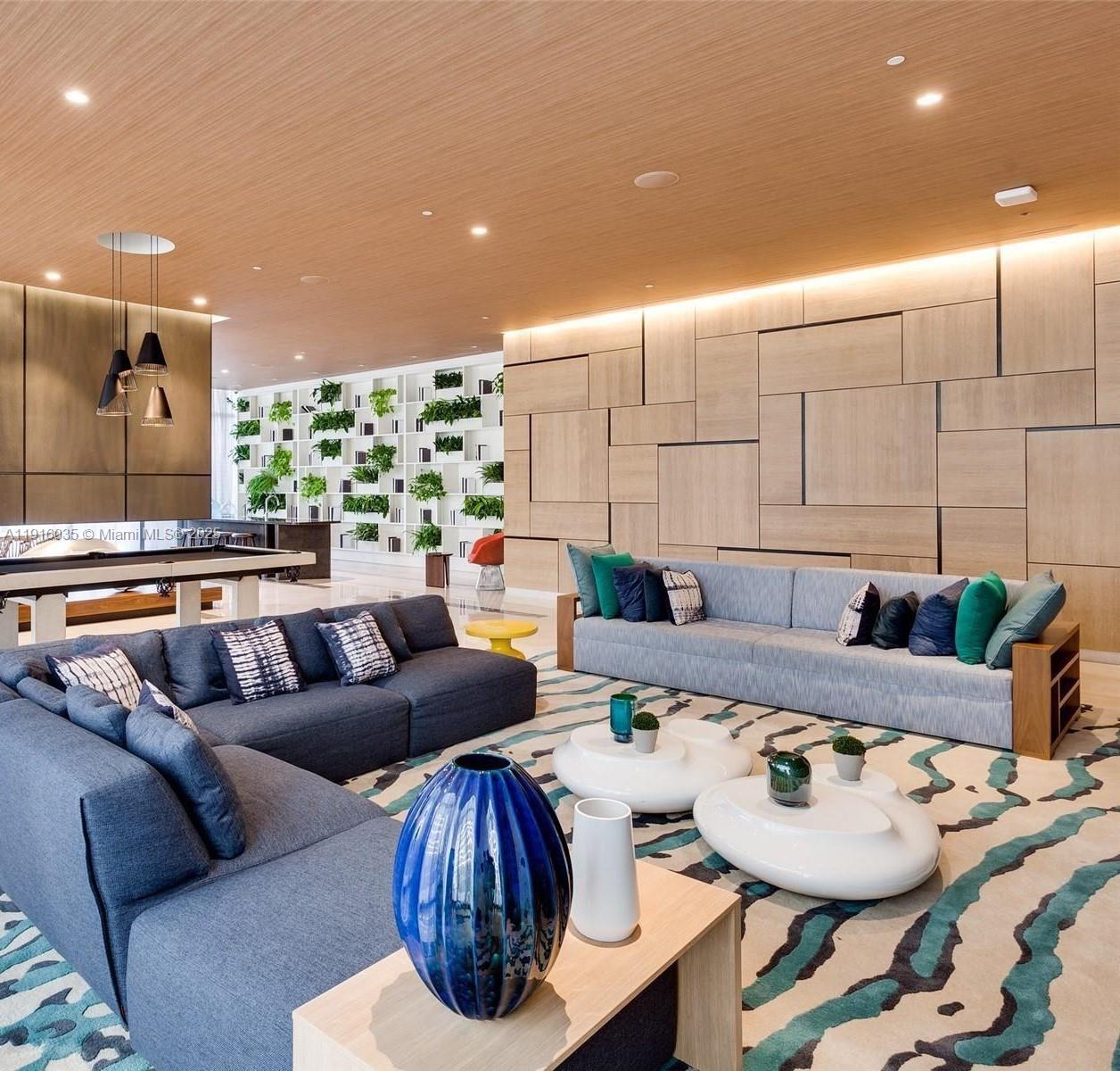 55 Southwest 9th Street, Unit 2902 Miami, FL 33130 - Photo 17 of 22 a living room with furniture and a large window