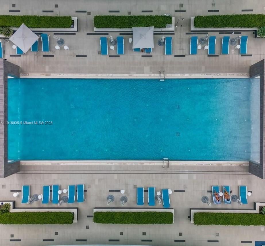 55 Southwest 9th Street, Unit 2902 Miami, FL 33130 - Photo 5 of 22 a front view of a house with lots of green space