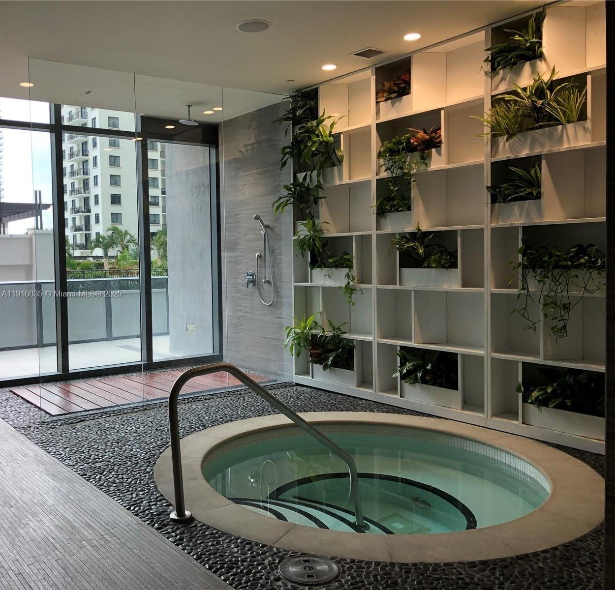 55 Southwest 9th Street, Unit 2902 Miami, FL 33130 - Photo 8 of 22 a kitchen with a window and a sink