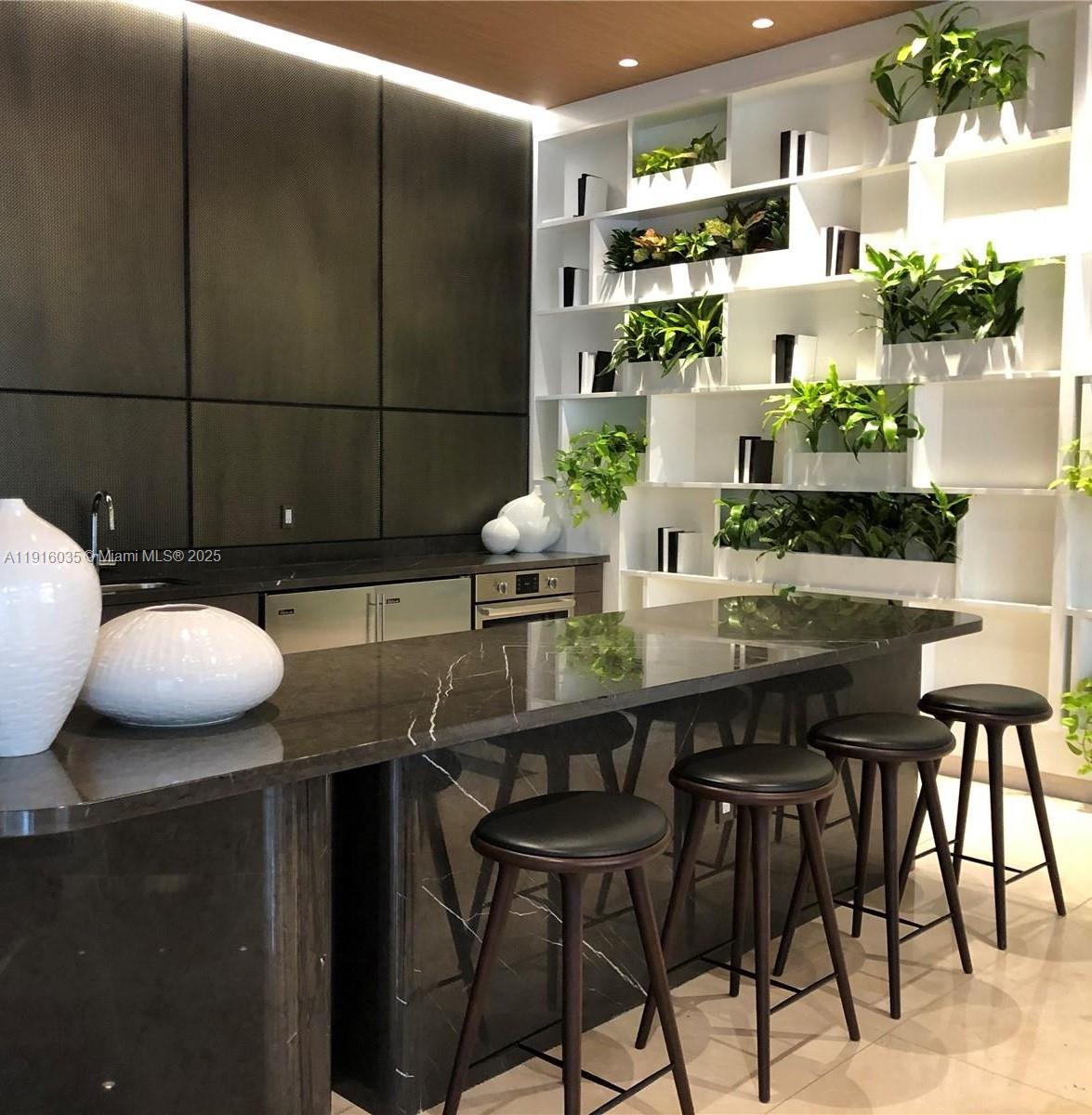 55 Southwest 9th Street, Unit 2902 Miami, FL 33130 - Photo 10 of 22 a dining room with furniture and wooden floor