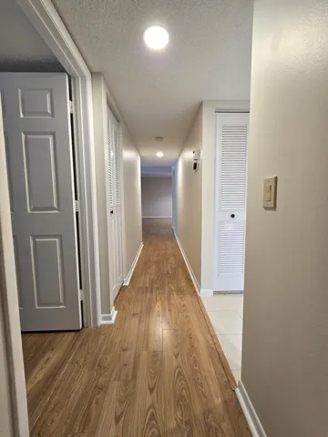 a kitchen with stainless steel appliances granite countertop a sink and a stove top oven