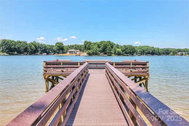 a view of outdoor space with wooden floor and lake view