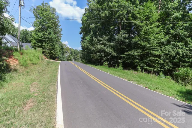 a view of a yard with potted plants