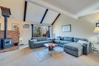a living room with furniture and kitchen view