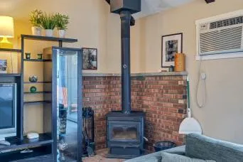 a bedroom with a bed and glass walk in closet