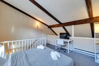 a bathroom with a sink a toilet a mirror and shower curtain