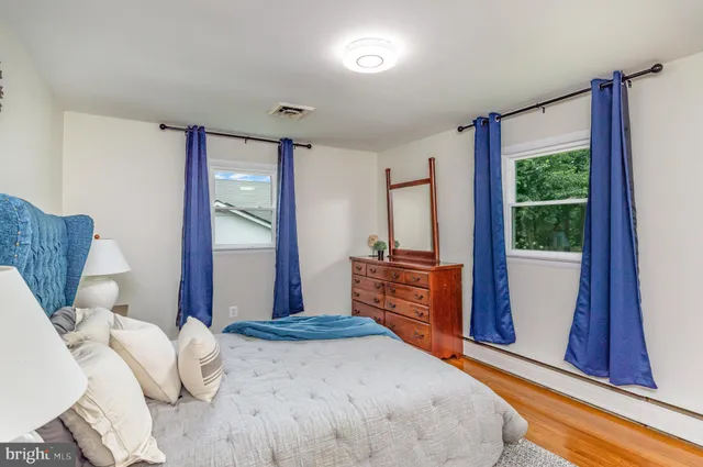 a bedroom with furniture and a window