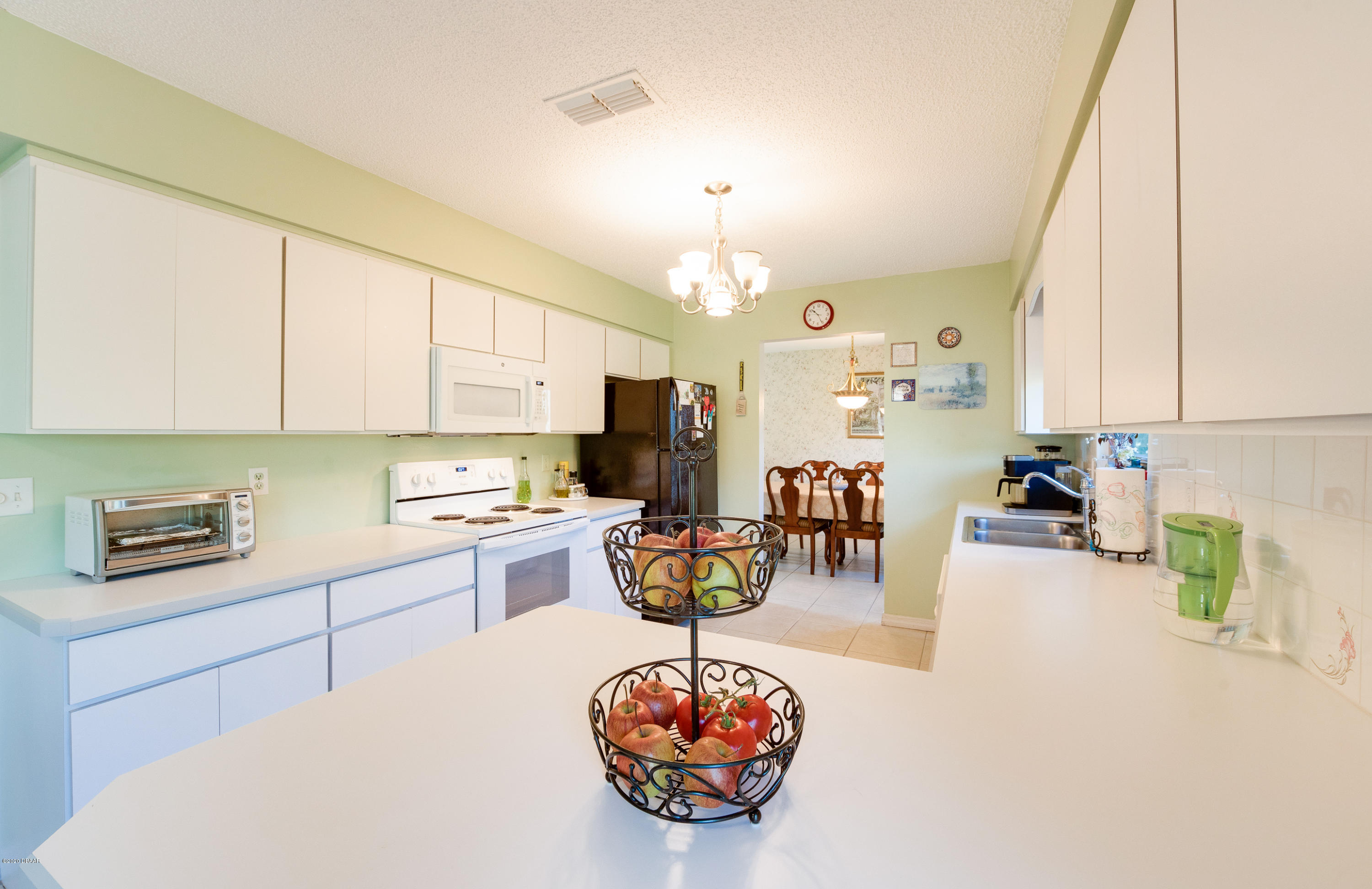 757 Hawks Ridge Road Port Orange, FL 32127 - Photo 23 of 34 Kitchen into Dining Room
