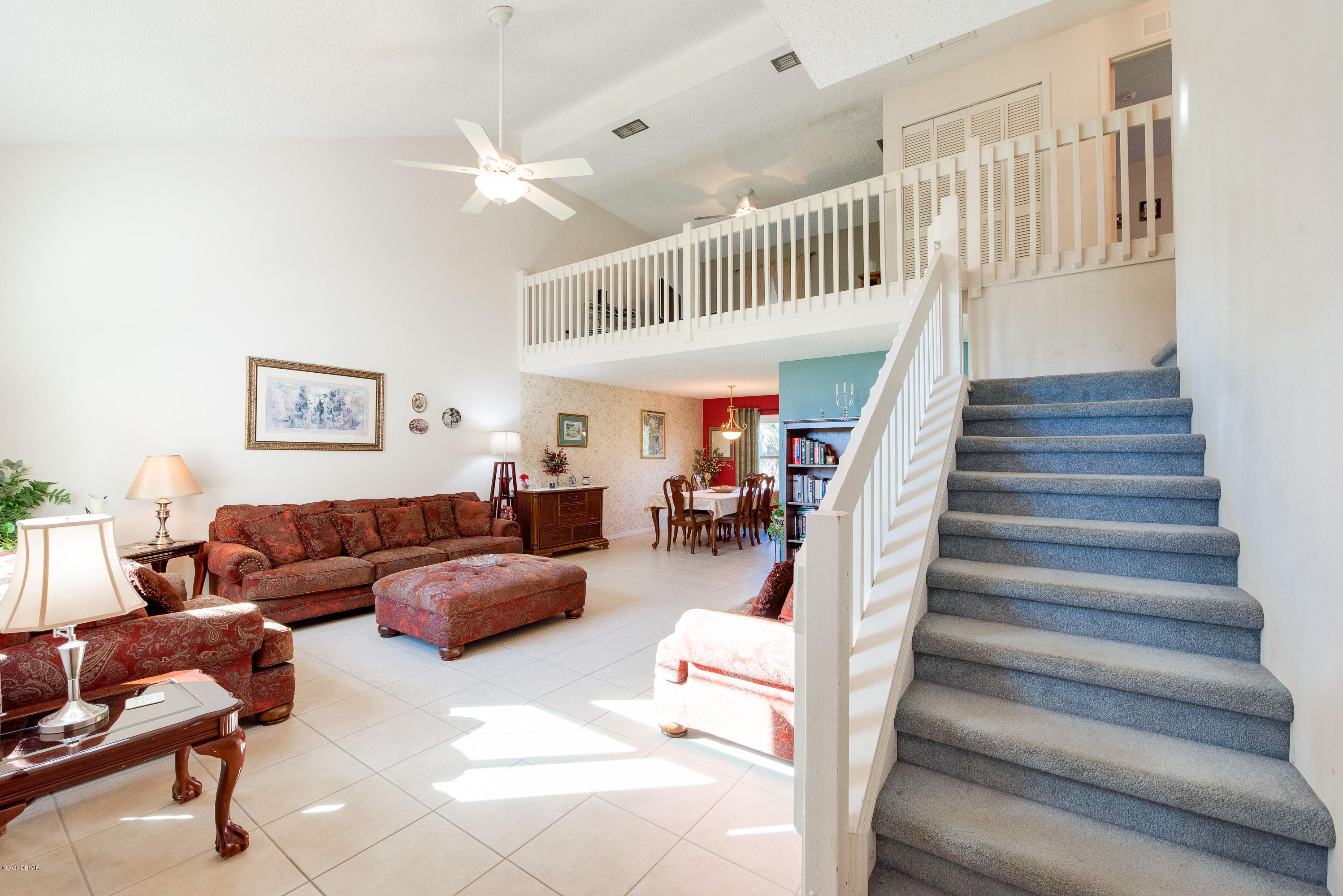 757 Hawks Ridge Road Port Orange, FL 32127 - Photo 3 of 34 3.Living Room into Dining Room.Stairs