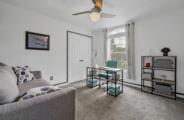 a living room with furniture and a window