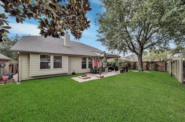 a view of a house with a yard porch and sitting area