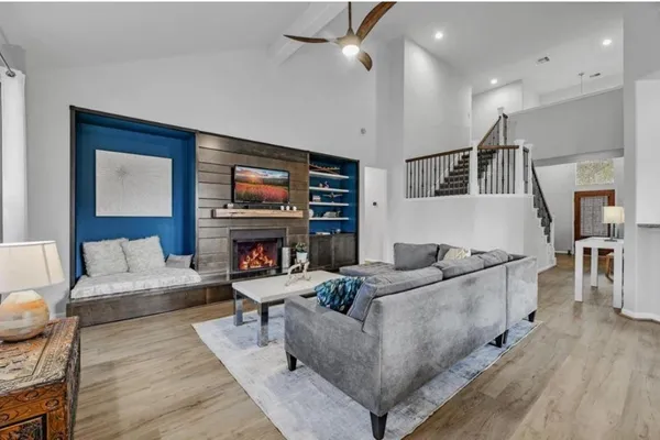 a living room with furniture and a fireplace