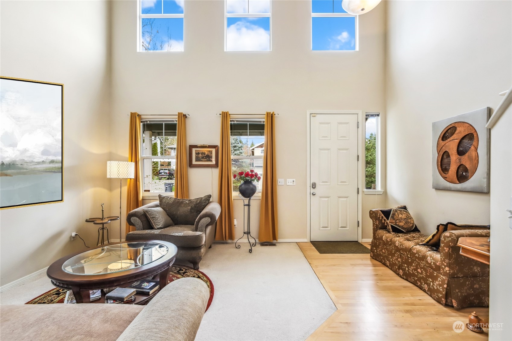 210 202nd Street Southeast Bothell, WA 98012 - Photo 12 of 33 a living room with furniture a rug and wall painting