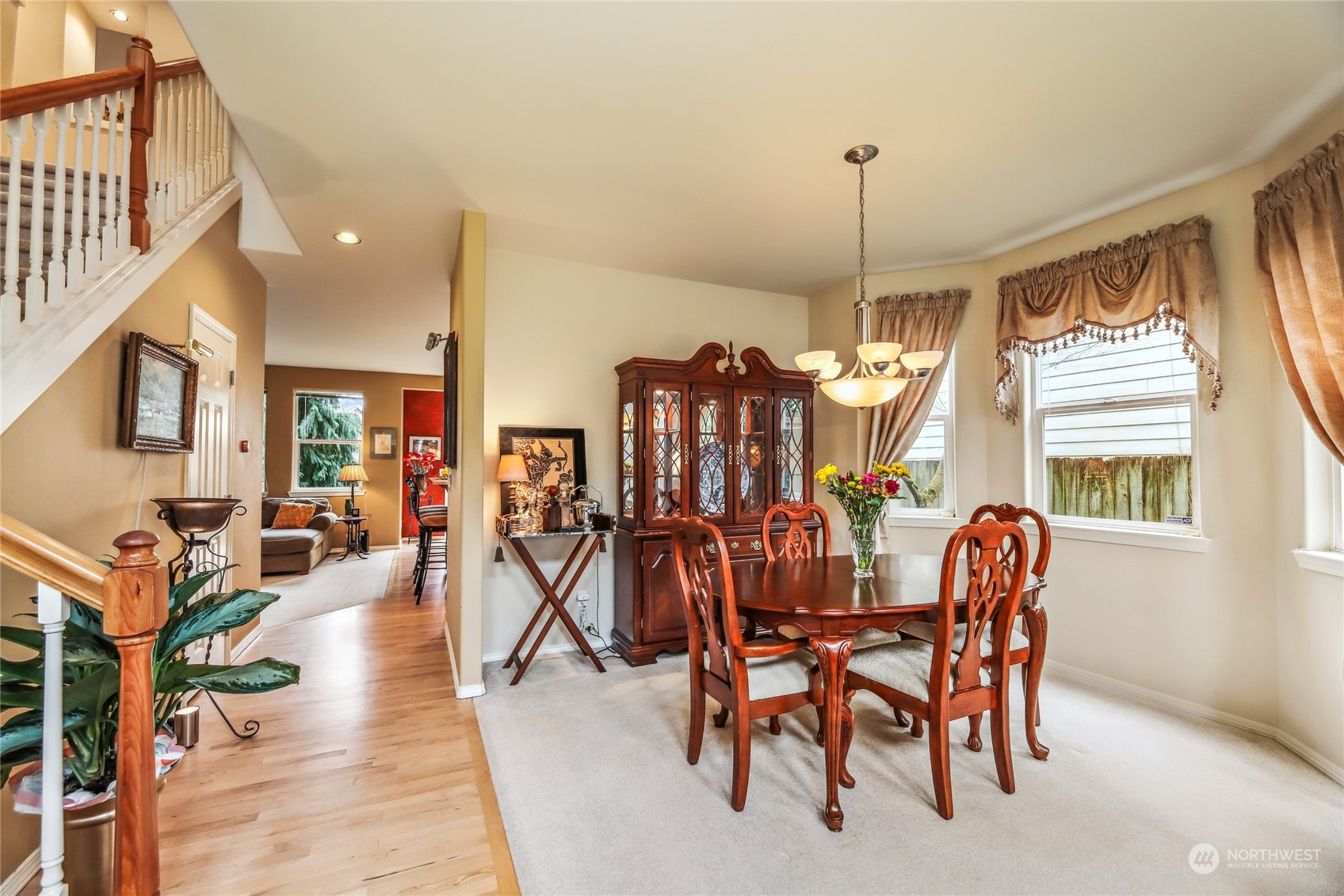 210 202nd Street Southeast Bothell, WA 98012 - Photo 15 of 33 a dining room with furniture window and wooden floor