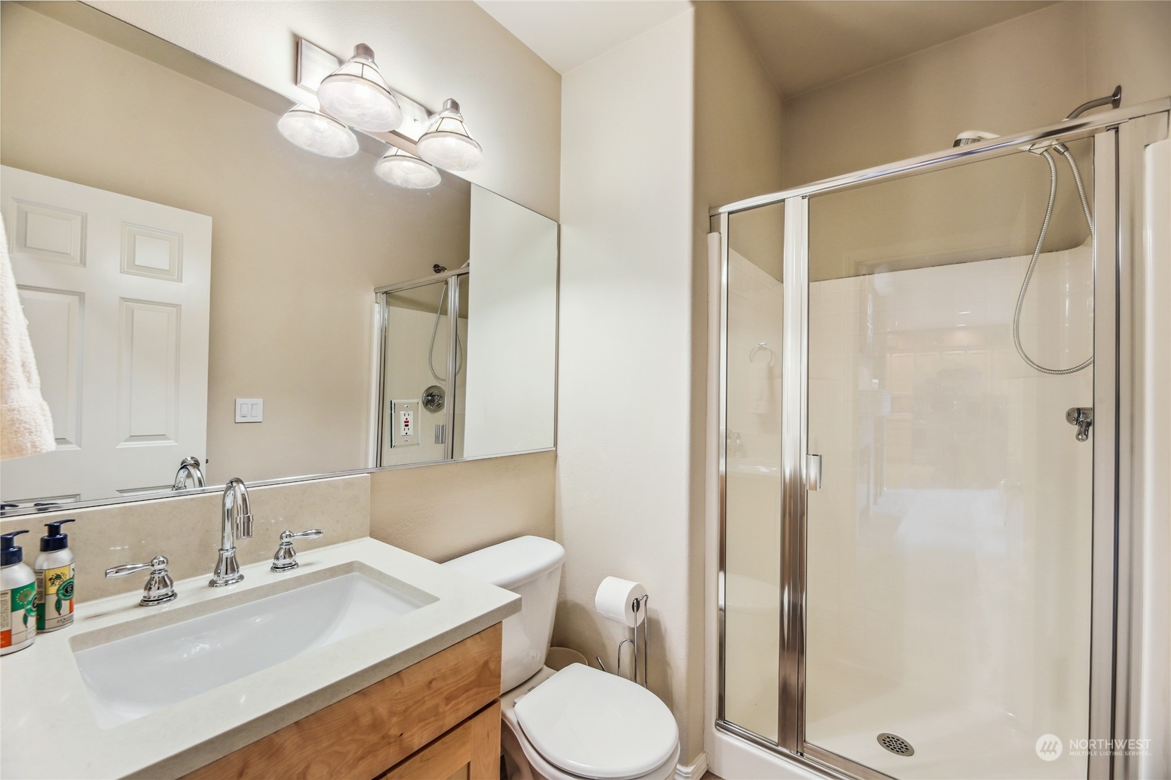 210 202nd Street Southeast Bothell, WA 98012 - Photo 16 of 33 a bathroom with a sink toilet vanity and shower