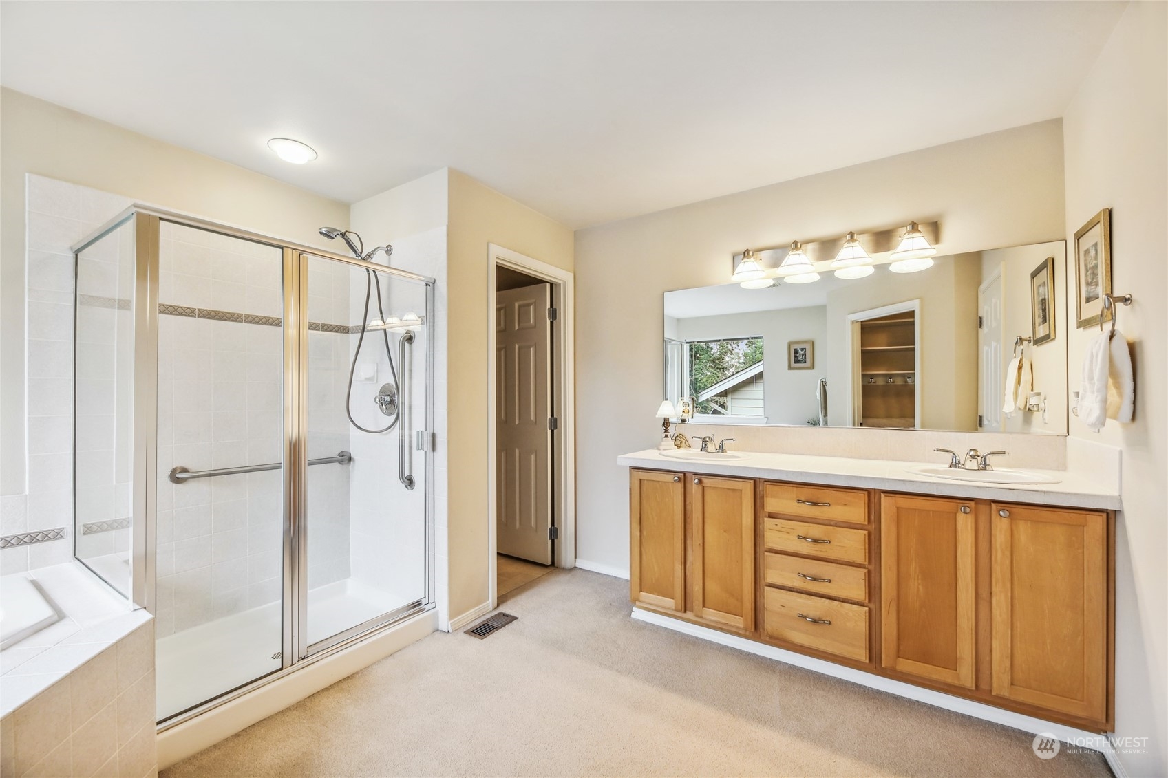 210 202nd Street Southeast Bothell, WA 98012 - Photo 19 of 33 a spacious bathroom with a shower sink and mirror
