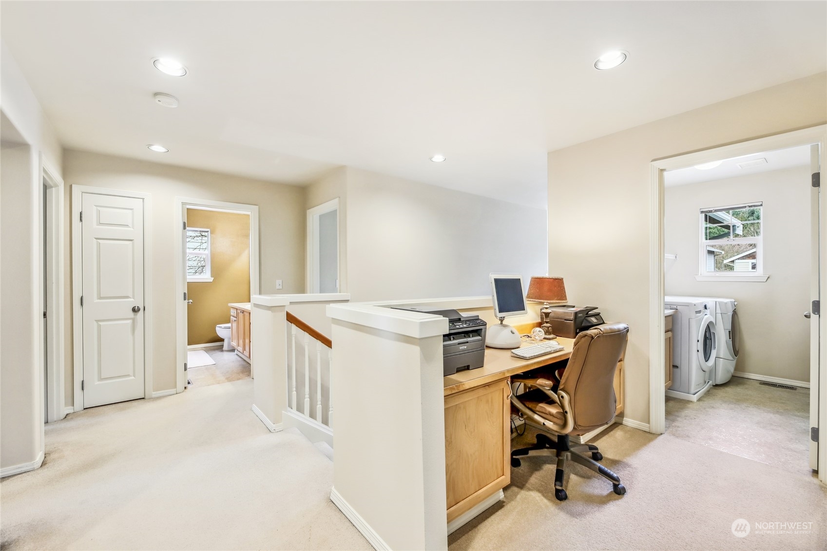 210 202nd Street Southeast Bothell, WA 98012 - Photo 22 of 33 a view of a workspace with furniture and a window