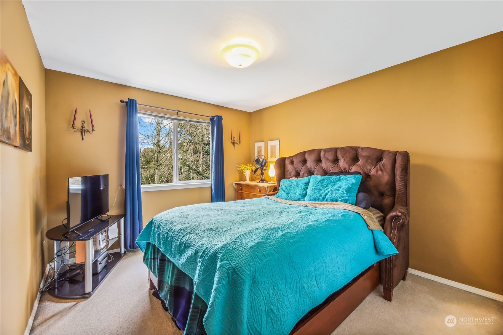 210 202nd Street Southeast Bothell, WA 98012 - Photo 25 of 33 a bed sitting in a bedroom next to a window