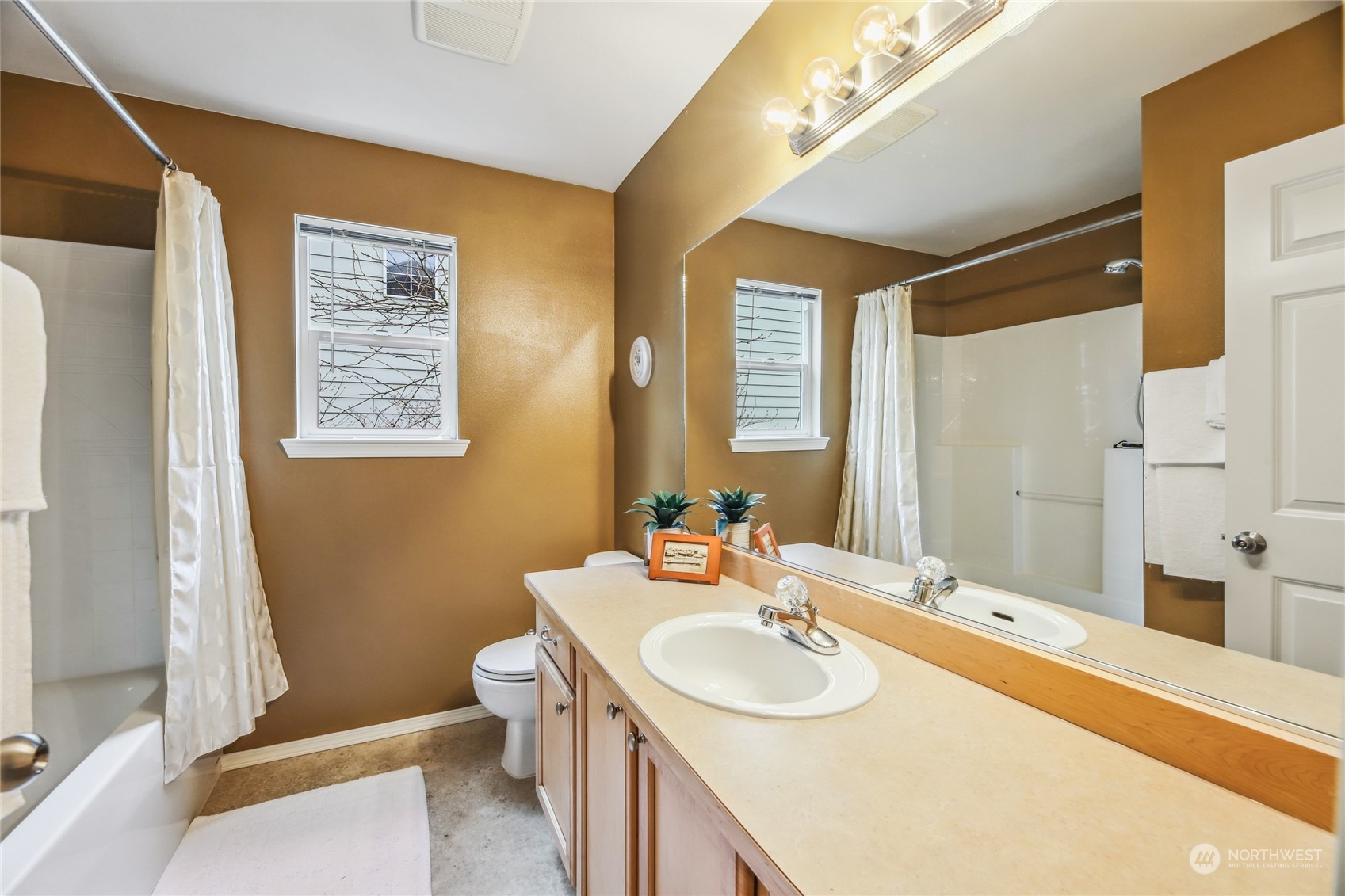 210 202nd Street Southeast Bothell, WA 98012 - Photo 26 of 33 a bathroom with a sink and a mirror