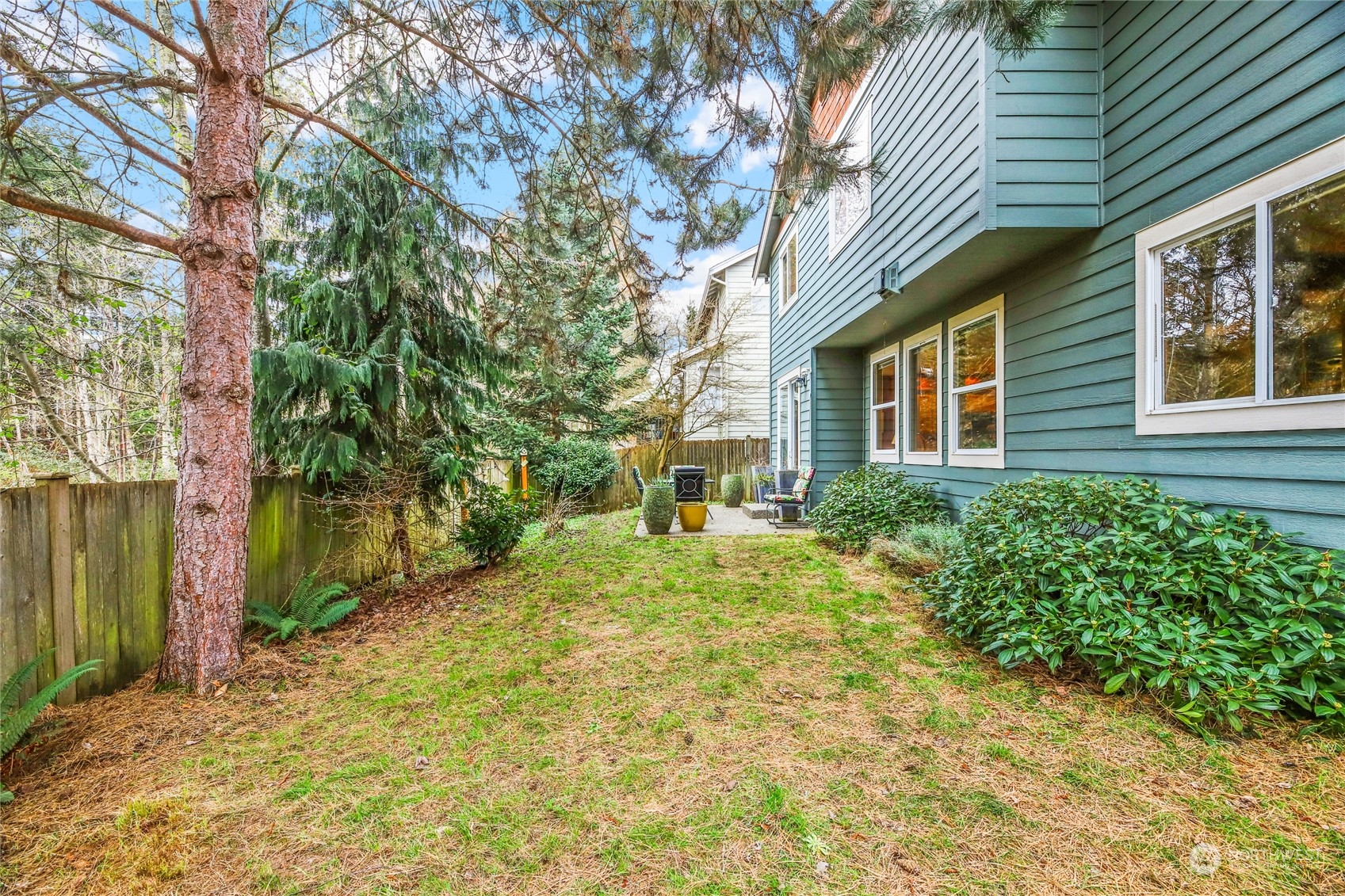 210 202nd Street Southeast Bothell, WA 98012 - Photo 29 of 33 a yellow house with trees in front of it
