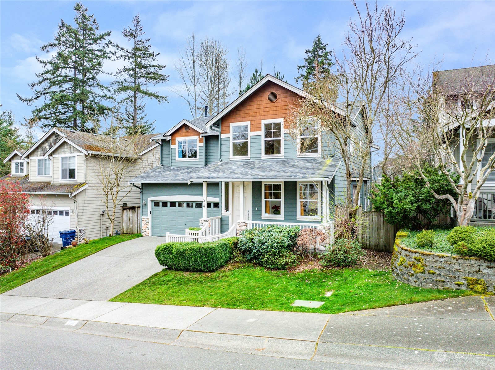210 202nd Street Southeast Bothell, WA 98012 - Photo 30 of 33 a front view of a house with a yard and potted plants