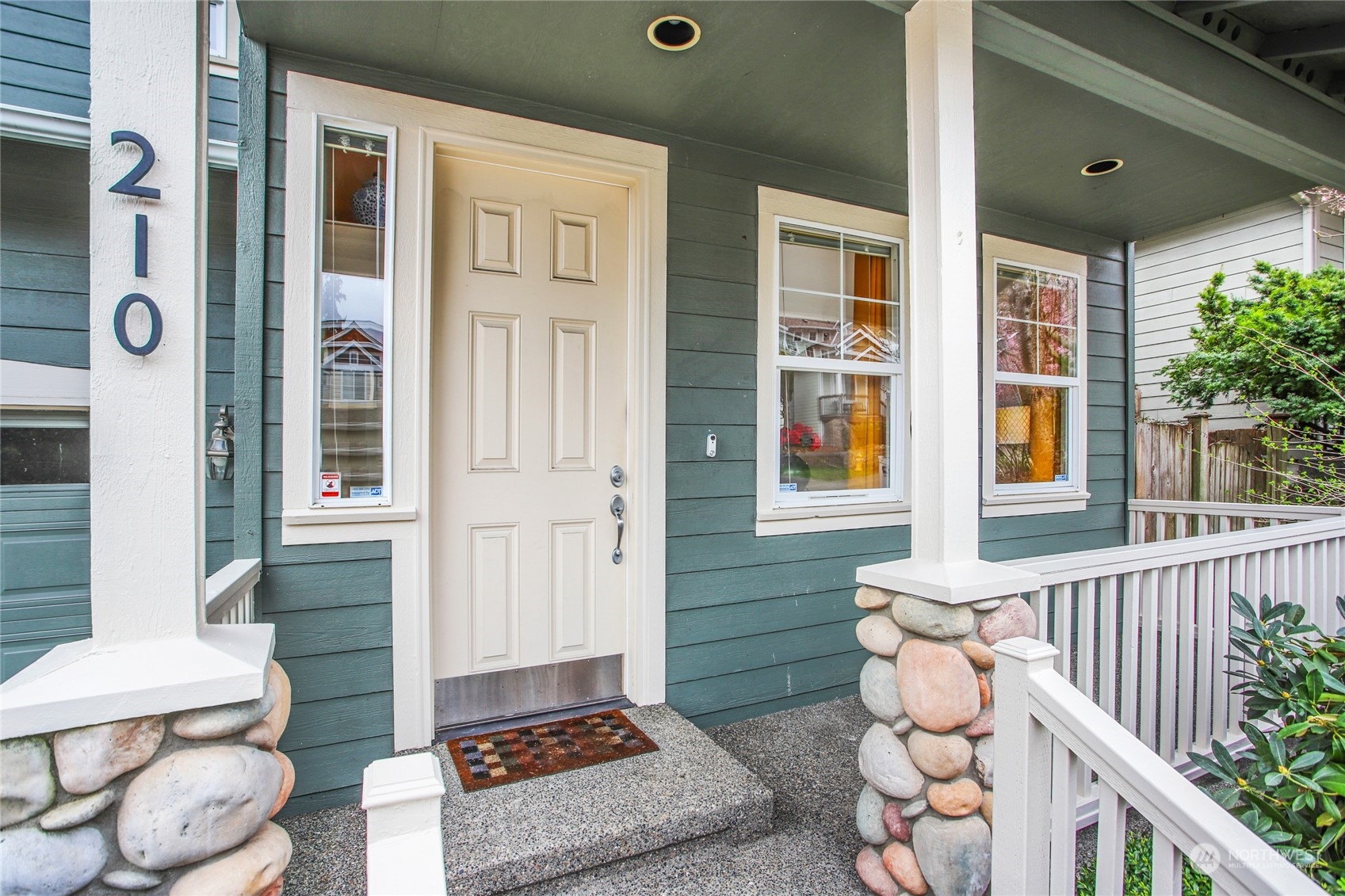 210 202nd Street Southeast Bothell, WA 98012 - Photo 3 of 33 a front view of a house with outdoor seating