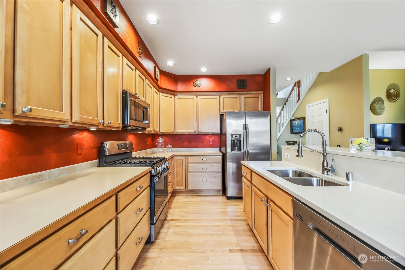210 202nd Street Southeast Bothell, WA 98012 - Photo 7 of 33 a kitchen with stainless steel appliances a sink and a stove