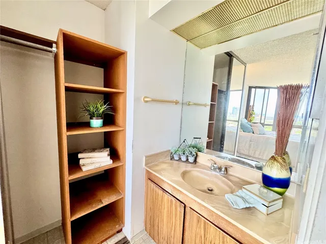 a bedroom with a large bed and a large window