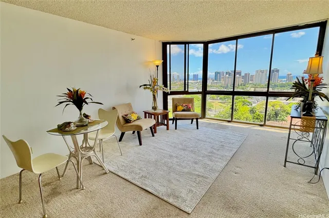 a living room with furniture and a large window