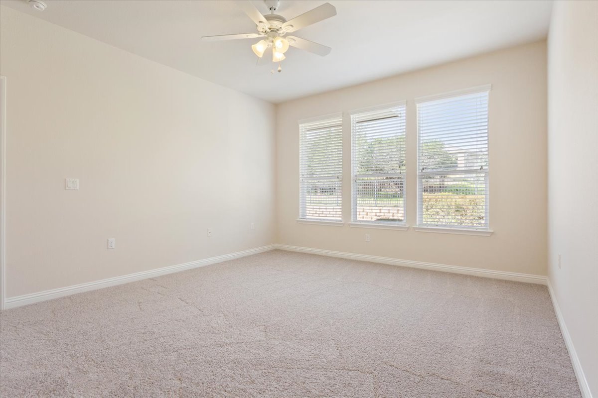 108 Cathedral Mountain Pass Georgetown, TX 78633 - Photo 19 of 36 an empty room with a window