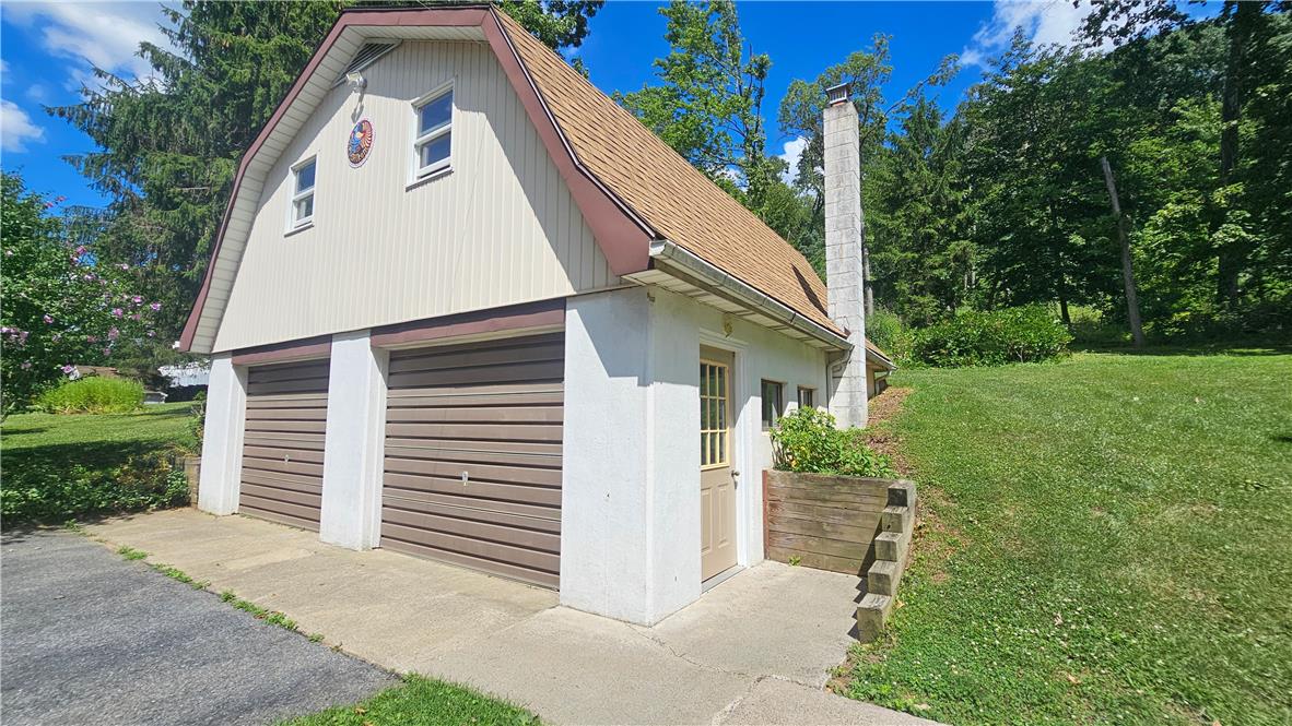 2529 Ringhoffer Road Hellertown, PA 18055 - Photo 22 of 33 Two bay garage with an attached single door entry and large chimney.