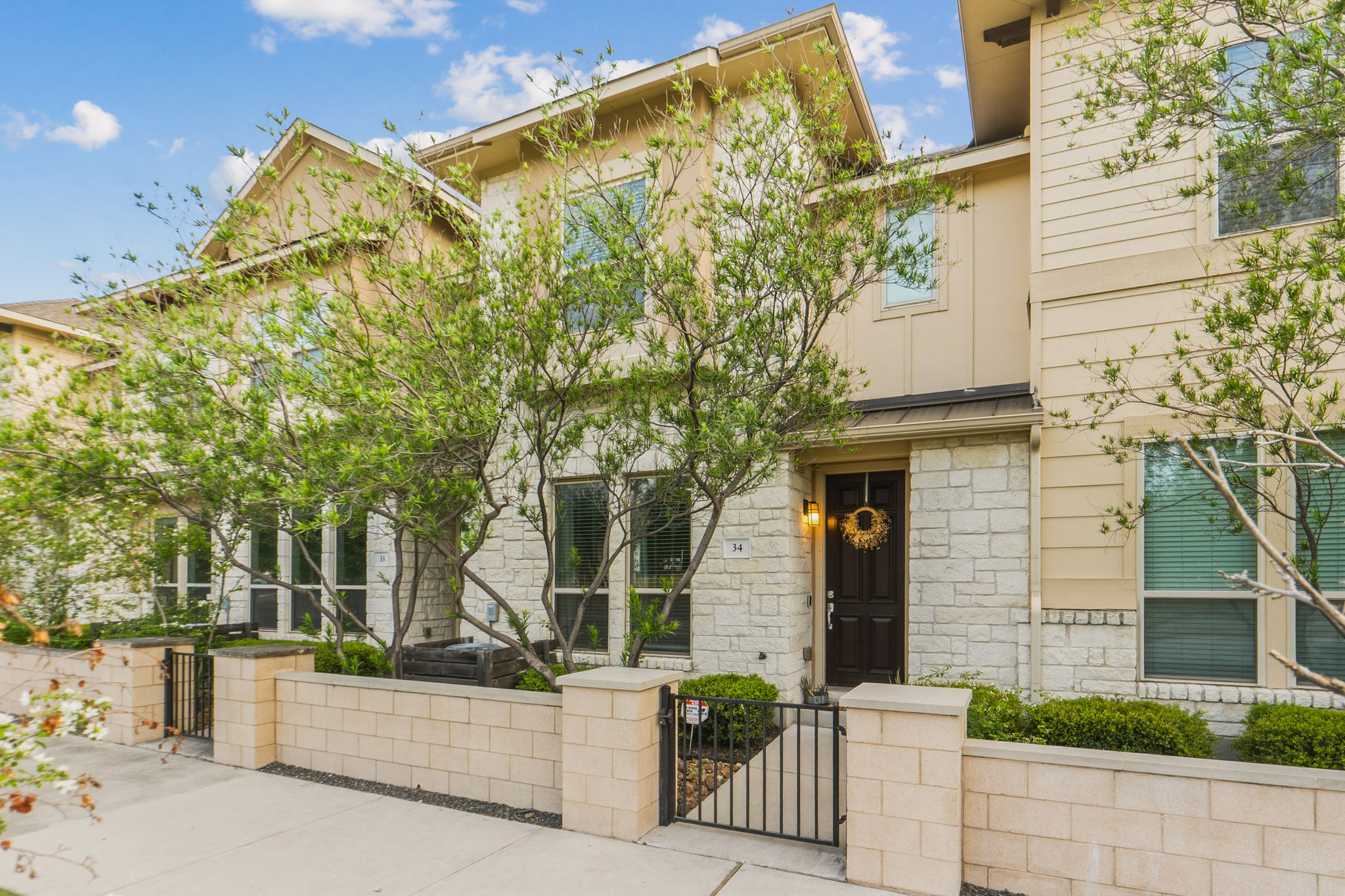 6814 East Riverside Drive, Unit 34 Austin, TX 78741 - Photo 2 of 26 a view of a house with a tree