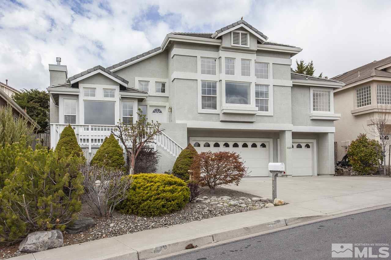 6020 Sunrise Meadows Loop Reno, NV 89519 - Photo 1 of 30 a front view of a house with garden
