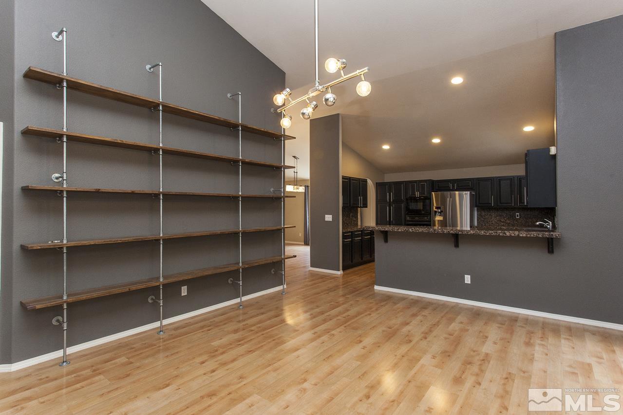 6020 Sunrise Meadows Loop Reno, NV 89519 - Photo 11 of 30 a view of a room with shelves and a ceiling fan
