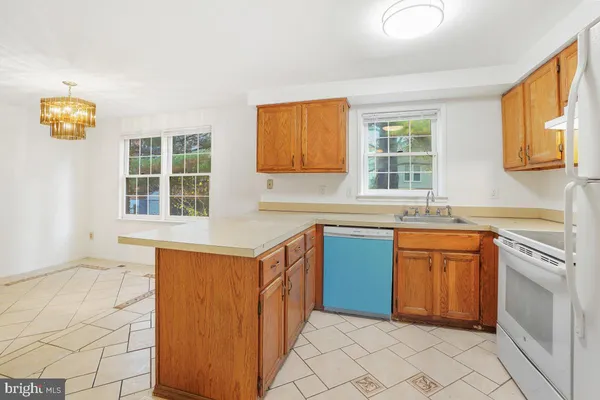 a kitchen with a sink and a refrigerator