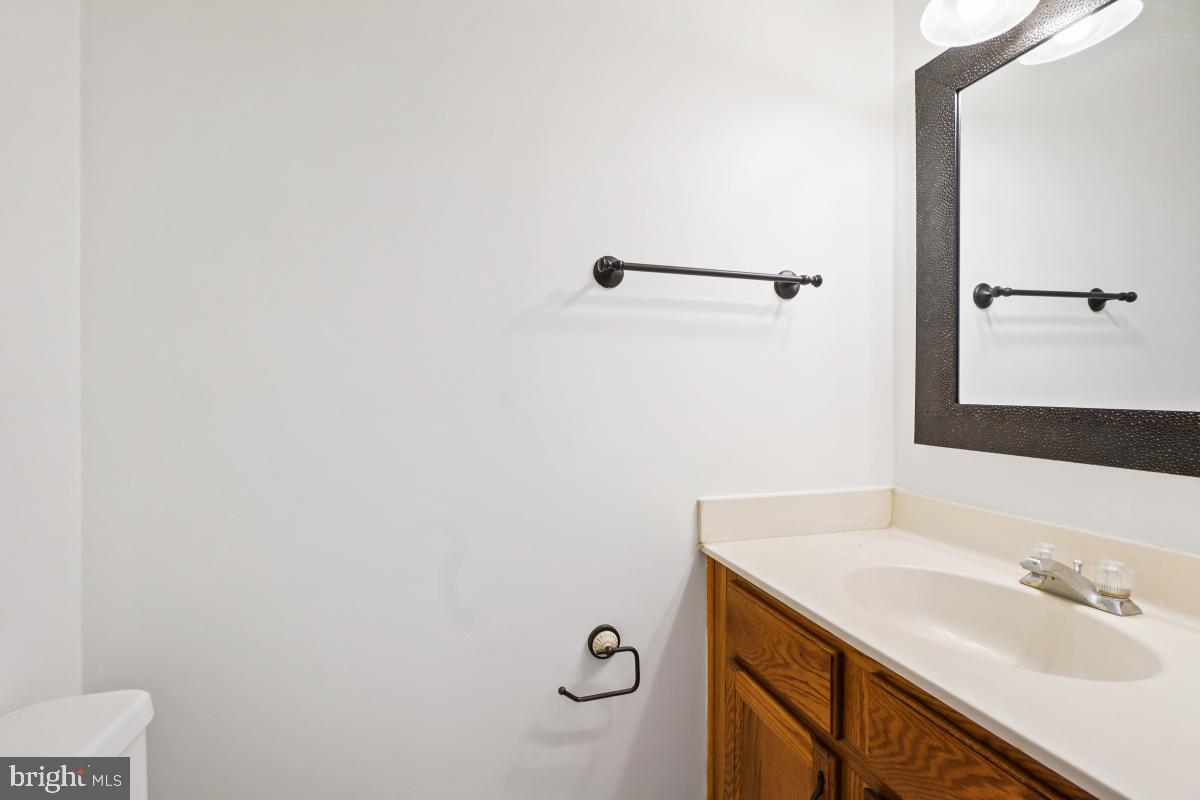13221 Black Walnut Court Silver Spring, MD 20906 - Photo 13 of 30 a bathroom with a sink and a mirror