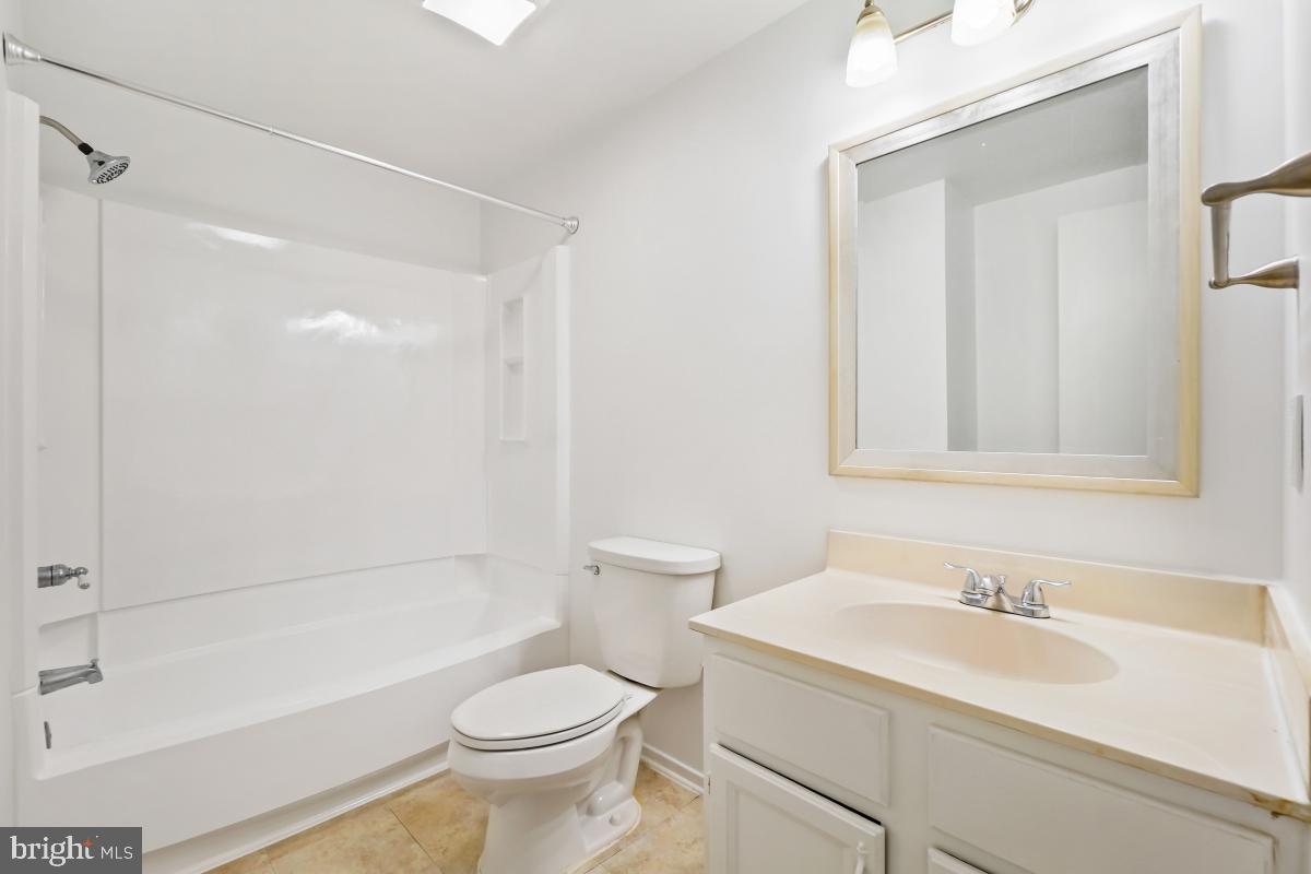 13221 Black Walnut Court Silver Spring, MD 20906 - Photo 21 of 30 a bathroom with a sink a toilet and shower