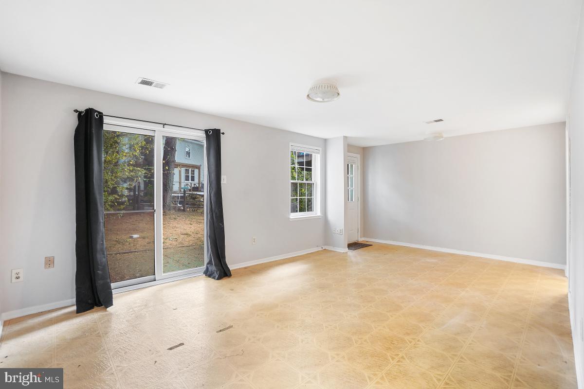 13221 Black Walnut Court Silver Spring, MD 20906 - Photo 22 of 30 an empty room with windows and closet