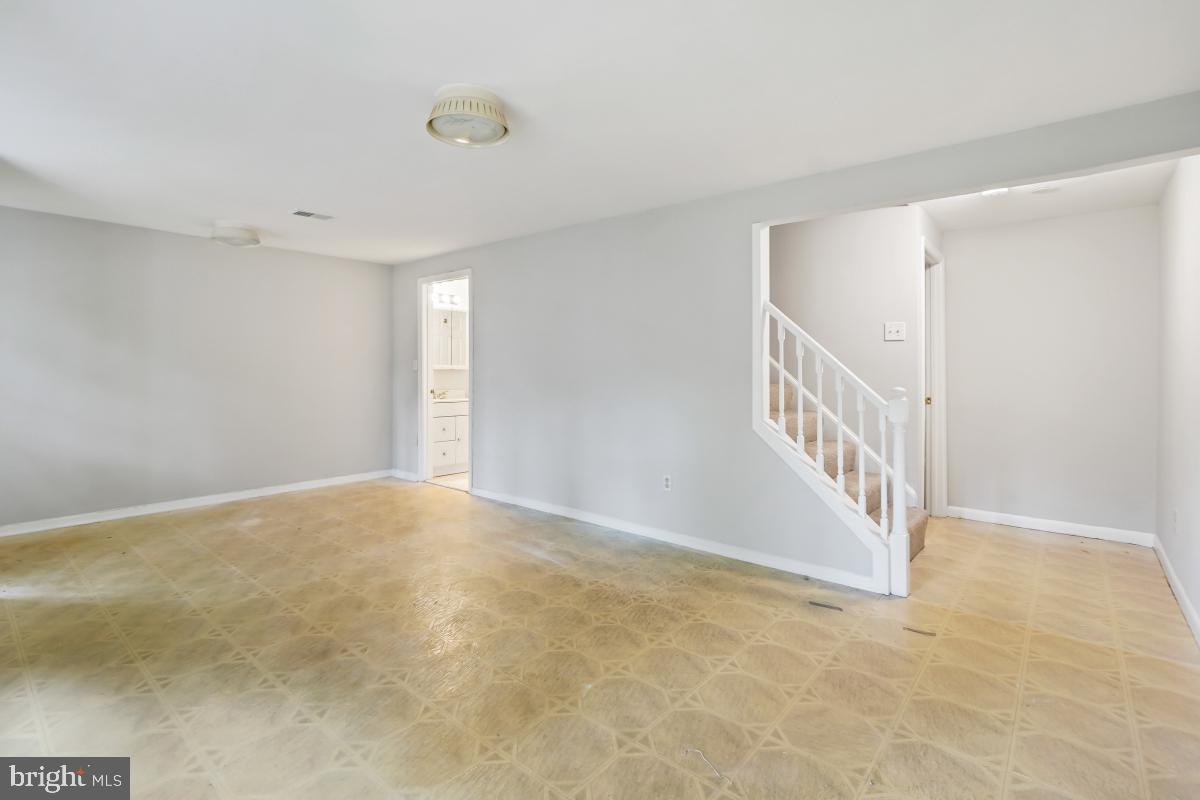 13221 Black Walnut Court Silver Spring, MD 20906 - Photo 23 of 30 a view of an empty room with stairs