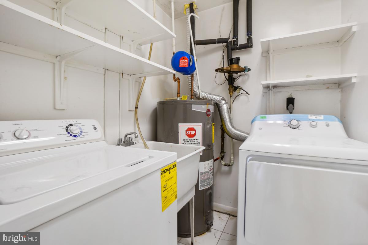 13221 Black Walnut Court Silver Spring, MD 20906 - Photo 26 of 30 a utility room with dryer and washer