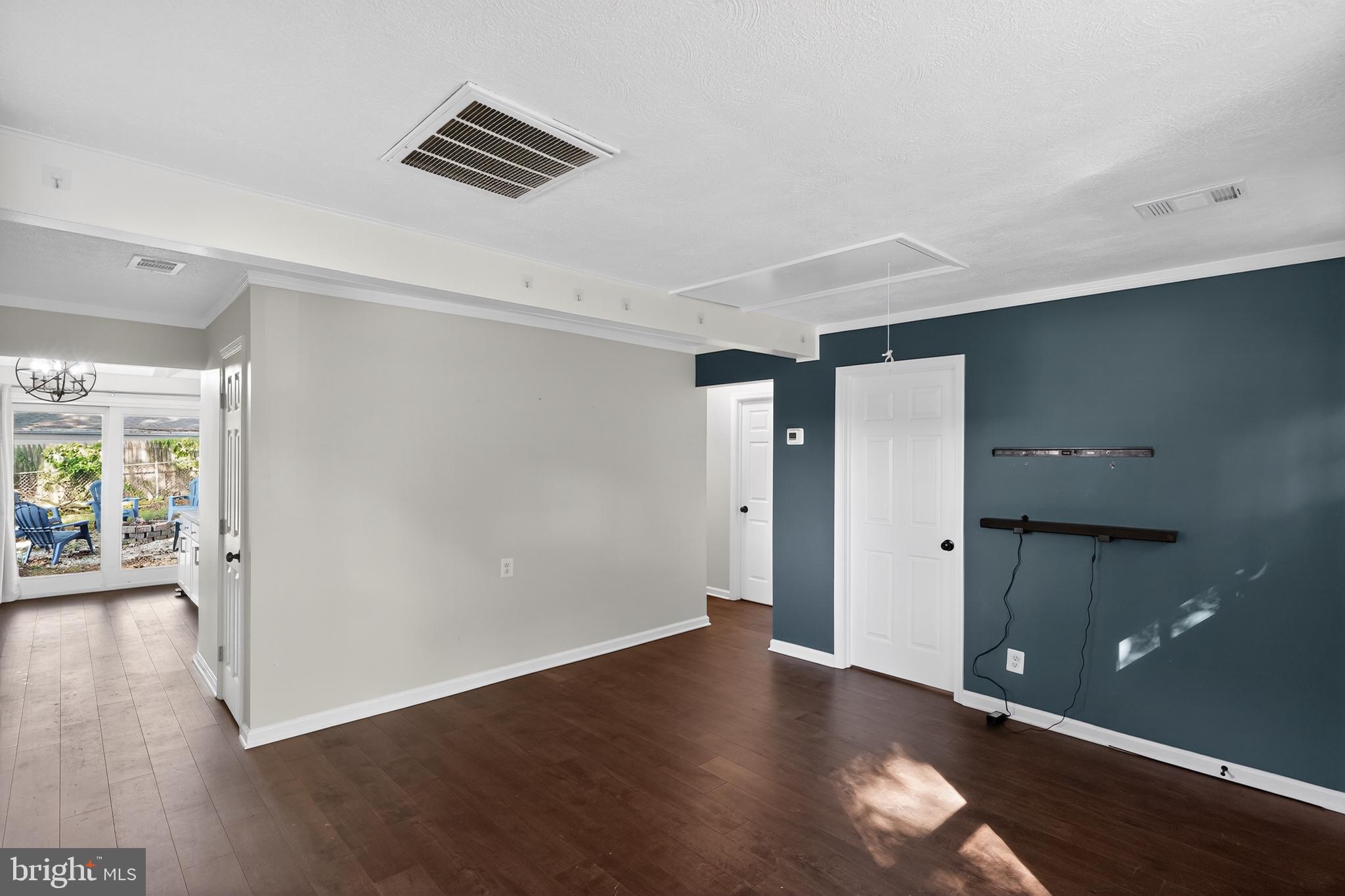 3670 5th Avenue Edgewater, MD 21037 - Photo 5 of 60 an empty room with wooden floor and windows
