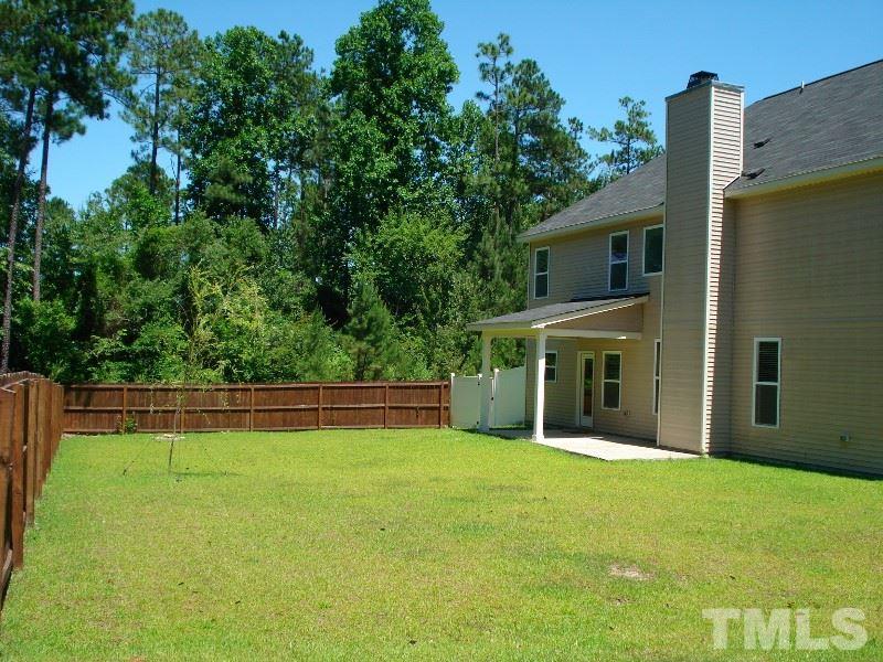 80 Germantown Road Cameron, NC 28326 - Photo 21 of 25 a front view of a house with a yard and trees