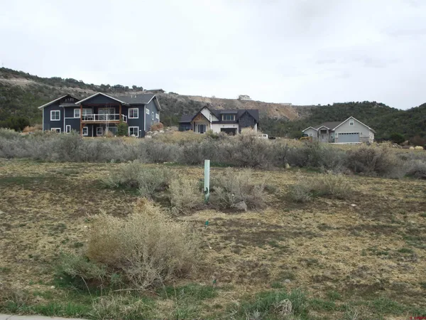 a view of a big house with a mountain in the background
