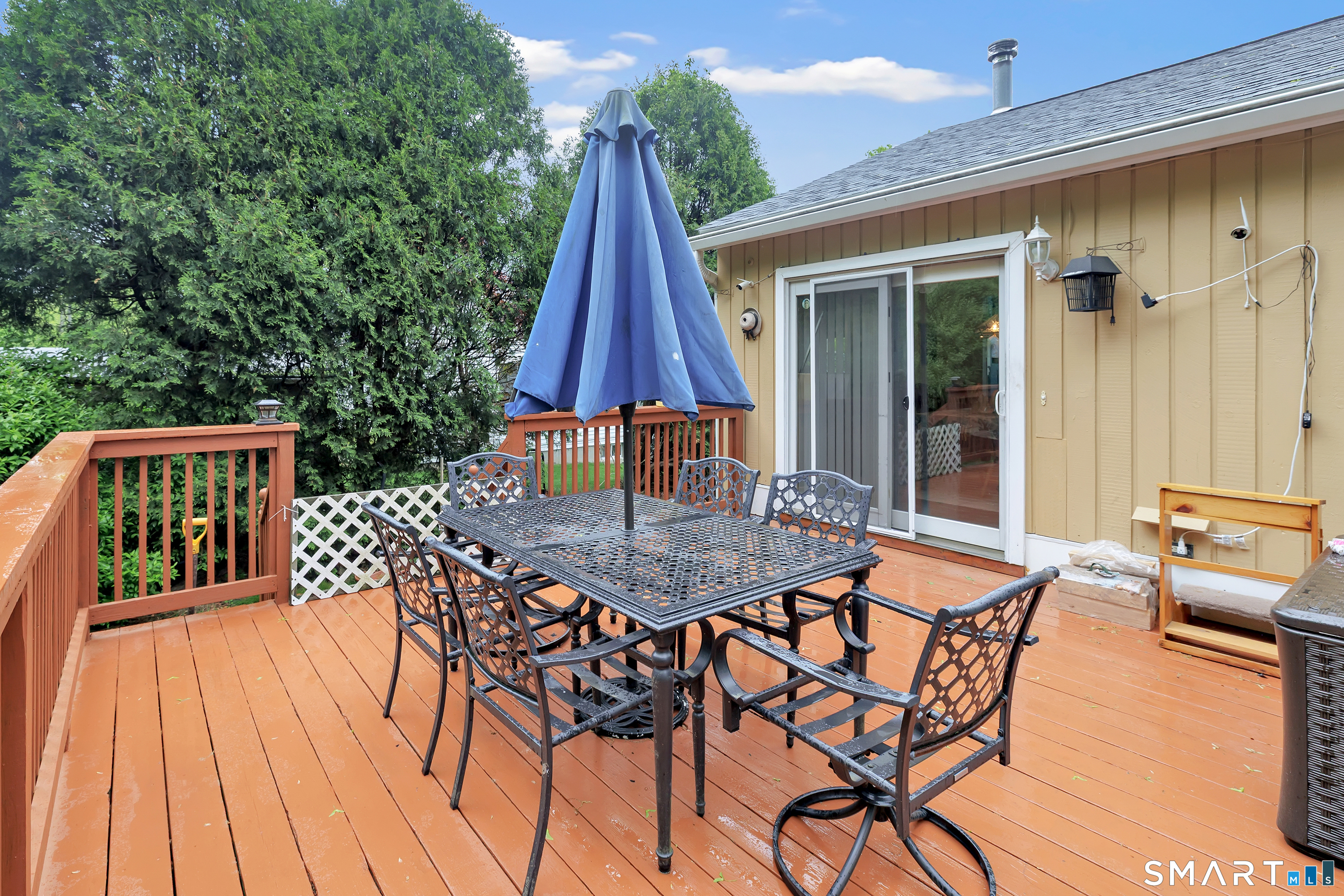 123 River Road Shelton, CT 06484 - Photo 25 of 27 a view of a patio with a table and chairs